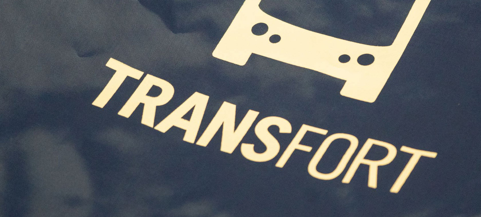 The Transfort logo on a printed brochure.