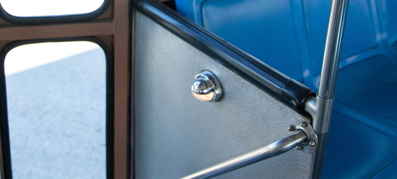 close up of bus bench and door